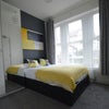 Photo 7: Room 2: Comfy bed with storage, extra tall wardrobe. 