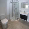 Photo 4: The ensuite bathroom, which is nice and spacious and has space for your laundry basket, and other th