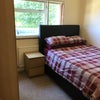 Photo 2: Double Bed with Full sized Ottoman stoage along with 2 drawer bedside unit. Bedroom 1