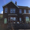 Photo 3: front view of Bank House