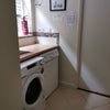 Photo 9: There is a washing machine and dryer