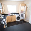 Photo 7: Kitchen with washer dryer