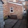 Photo 5: Rear patio ideal for sitting out and enjoying potted flowers