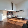 Photo 2: Open plan living area/kitchen with floor to ceiling glass.