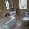 Photo 6: Bathroom. Includes a bath and a shower, as well as a sink cupboard and a mirror cupboard for storage