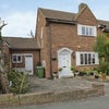 Photo 5: This is the front of the house. It has a drive-way and plenty of off-road parking.