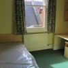 Photo 3: Big Room with desk, and a closet with additional storage space under the bed.