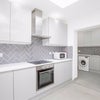 Photo 4: Kitchen and utility area with washing machine and dishwasher