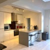 Photo 2: Full size kitchen with smeg appliances, two fridge freezer, washing machine and dishwasher.