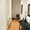 Photo 9: Spacious hallway with storage cupboard 