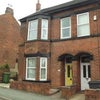 Photo 2: Front of Property