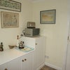Photo 3: Own entrance with fridge freezer, microwave and toaster. Cutlery and china. Ample storage