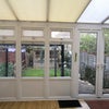 Photo 3: Conservatory and back garden