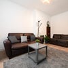 Photo 1: Living room with sofa bed