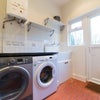 Photo 10: Separate utility room with washing machine and dryer