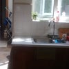 Photo 5: Kitchen with downstairs, utility room and  bathroom behind.