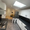 Photo 2: Shared Kitchen and dining space