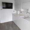 Photo 7: Kitchen with TV, washer/dryer and Freezer