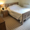 Photo 2: Comfortable king size bed in clean , light airy room .Top quality John Lewis Yorkshire wool mattress