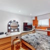 Photo 17: Bedroom 3 - desk / dressing table with illuminated mirror, double bed, and ample storage