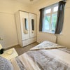 Photo 2: Another view of the room with small double bed and 1.2 meter wardrobe