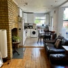 Photo 6: The kitchen and living area.