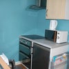 Photo 7: Kitchen with induction hob, oven, fridge, microwave and washing machine and etc.