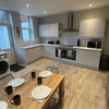 Photo 2: Modern kitchen/dining area