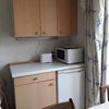 Photo 4: Fridge, microwave, toaster and kettle in breakfast room.