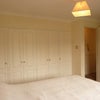 Photo 2: Bedroom 1 with built in wardrobes
