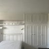 Photo 1: Double bed and fitted wardrobe 