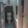 Photo 5: Bathroom (sink and storage to be found behind door.