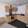 Photo 3: SLEEK FITTED KITCHEN
