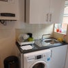 Photo 2: Kitchen - washing machine, sink/boiler