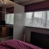 Photo 2: Storage and front of house view 