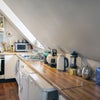 Photo 7: Kitchen showing white goods, hob and oven.
