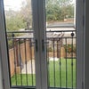 Photo 2: Balcony looking over the garden 