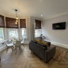 Photo 5: Kitchen/ Living Area