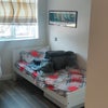 Photo 8: Bedroom with single bed and artwork