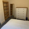 Photo 8: Room 2 Bookcase, chest of drawers