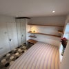 Photo 3: Room 2. 1st floor front double, small home office with tv over, double bed and en-suite.  £650