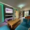 Photo 5: Large front room with dining/work area and seating for tv/movie nights.