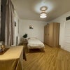 Photo 1: Very spacious room with two windows, and large storage wardrobe with sections. 