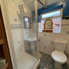 Photo 7: Shower and toilet.