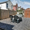 Photo 8: Sunny rear garden with seating and secure bike storage