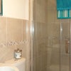 Photo 7: Lovely tiled bathroom with walk in shower 