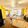 Photo 5: Kitchen and living area