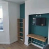Photo 2: Living room with TV