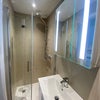Photo 5: Lovely Hans Grohe shower with slick bi-fold shower doors