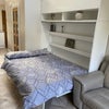 Photo 4: Easy fold down double bed - can be folded with bedding on